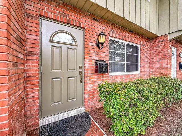 a view of empty room with floor to ceiling window