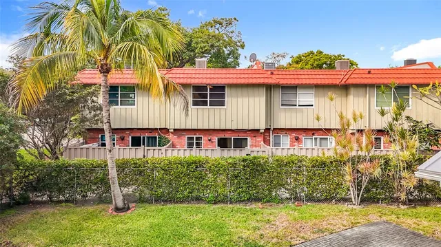 an aerial view of residential houses with city view