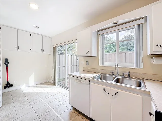 a kitchen that has a sink and a window