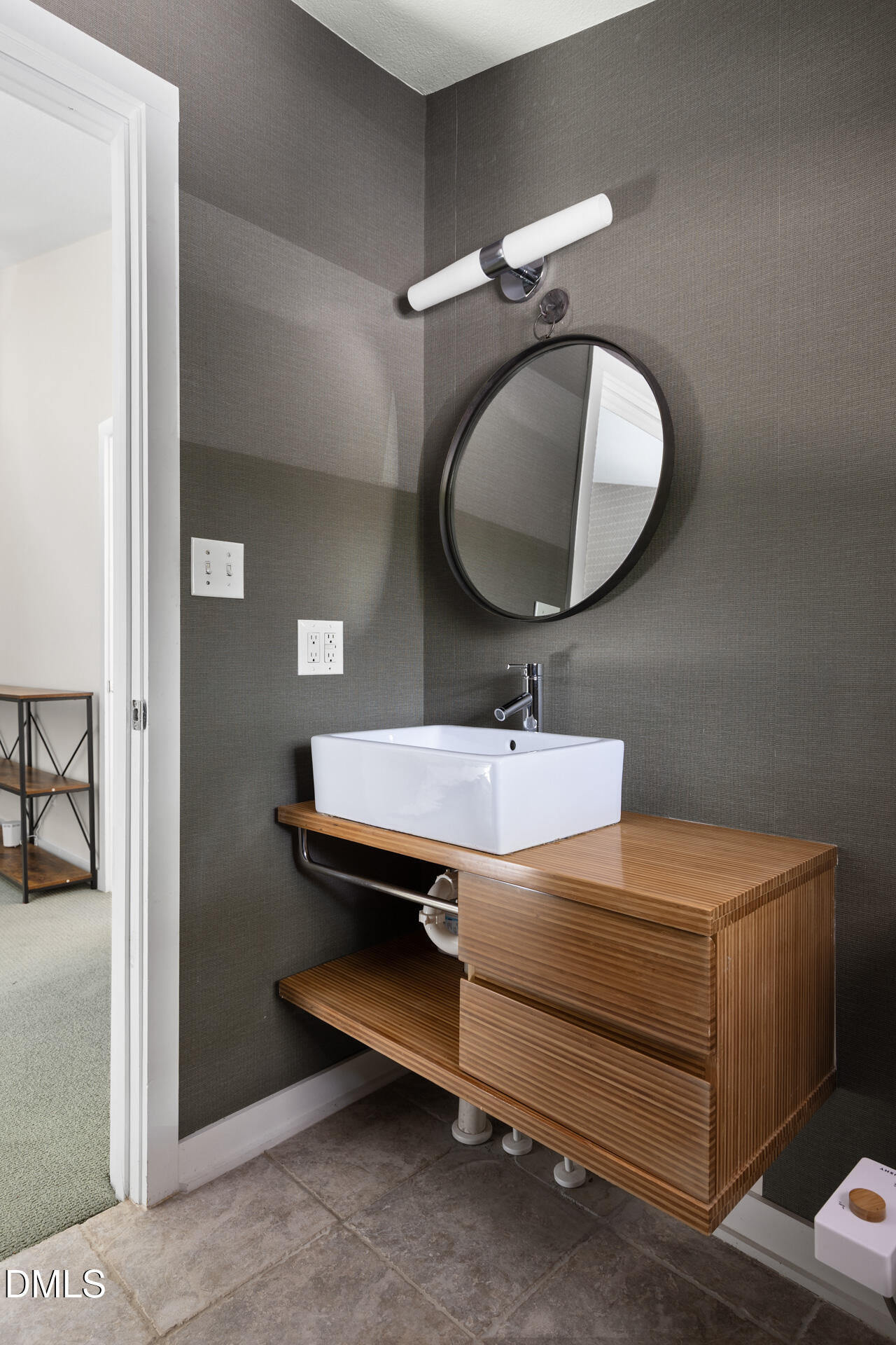 5208 Saddle Court Raleigh, NC 27609 - Photo 38 of 43 a bathroom with a sink and a mirror