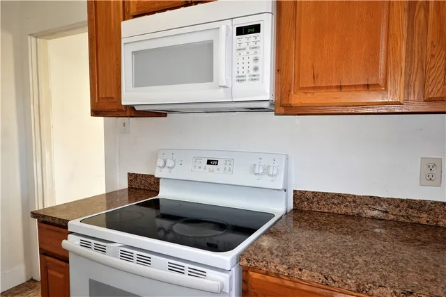 a kitchen with a stove and a microwave
