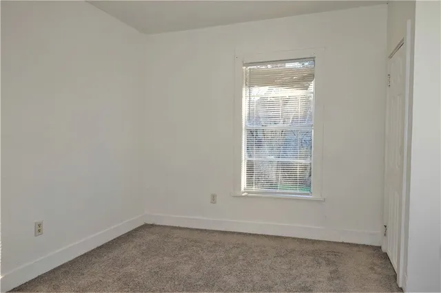 a bathroom with a toilet and a bathtub