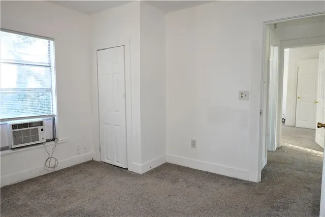 en empty room with windows