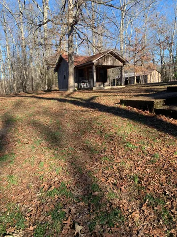 a view of road with large trees