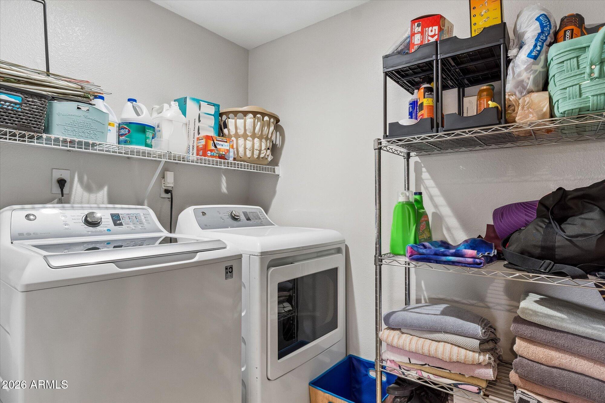 10030 West Indian School Road, Unit 269 Phoenix, AZ 85037 - Photo 17 of 29 a utility room with dryer and washer