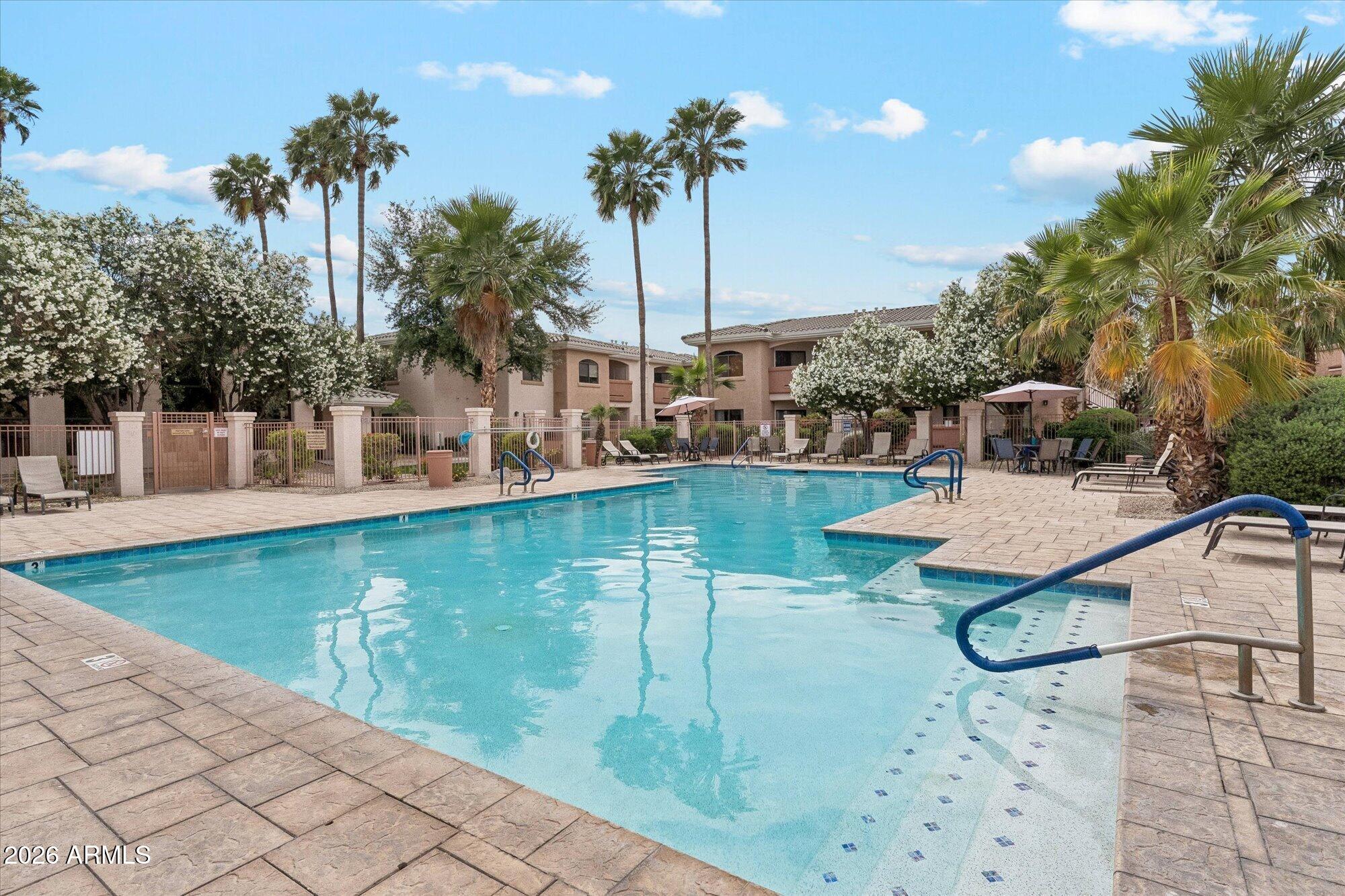 10030 West Indian School Road, Unit 269 Phoenix, AZ 85037 - Photo 22 of 29 a view of a swimming pool with a patio