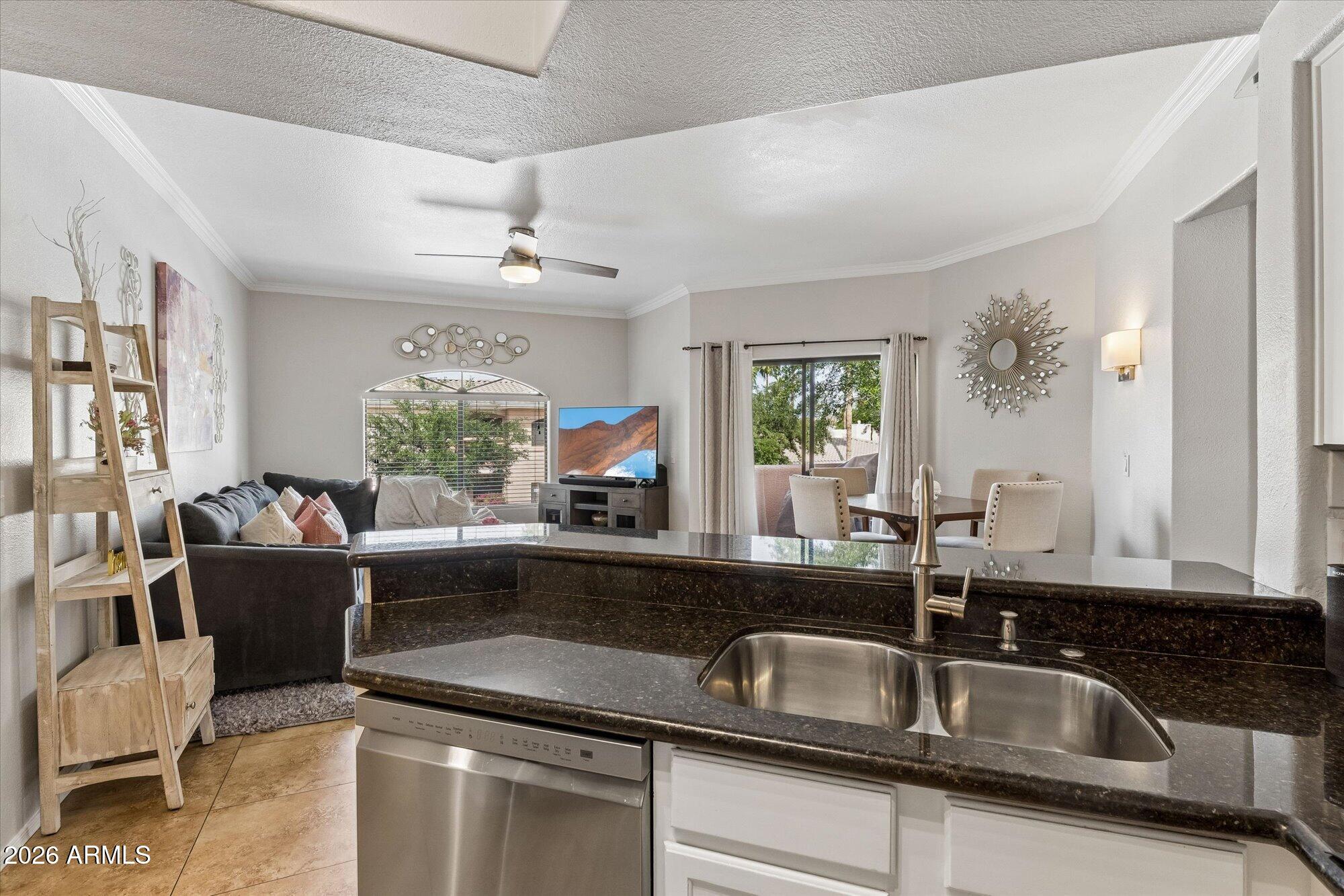 10030 West Indian School Road, Unit 269 Phoenix, AZ 85037 - Photo 4 of 29 a kitchen with a sink and a potted plant