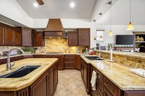 a kitchen with a sink and wooden cabinets