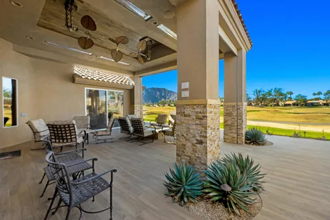 a outdoor space with patio furniture and wooden floor