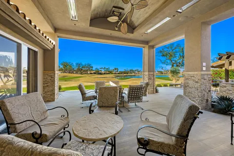 a outdoor space with patio the couches and potted plants
