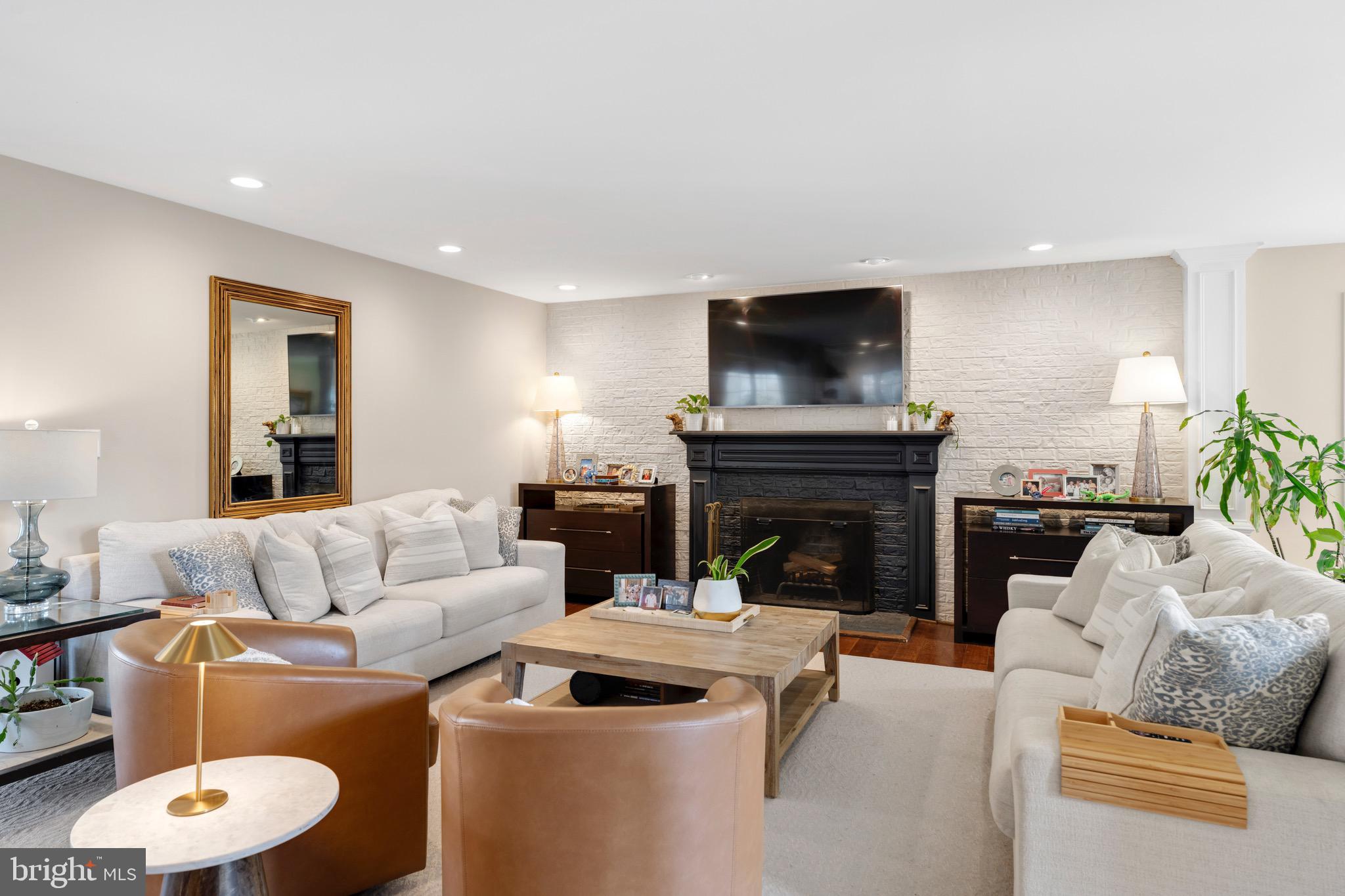 3618 Jackson Cabin Road Phoenix, MD 21131 - Photo 12 of 68 a living room with furniture a flat screen tv and a fireplace