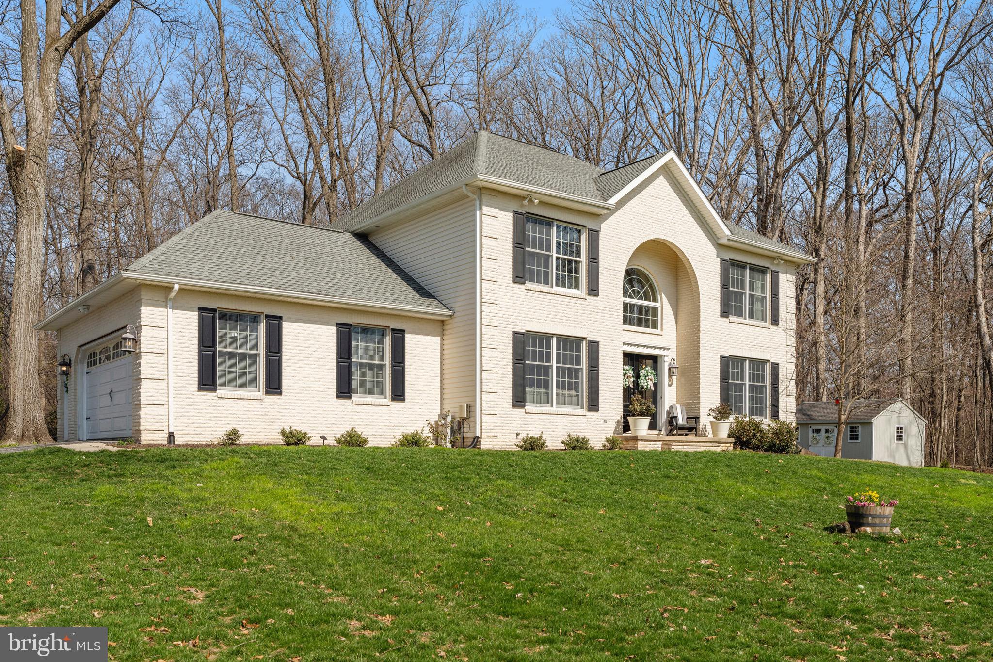 3618 Jackson Cabin Road Phoenix, MD 21131 - Photo 23 of 68 a front view of a house with a yard