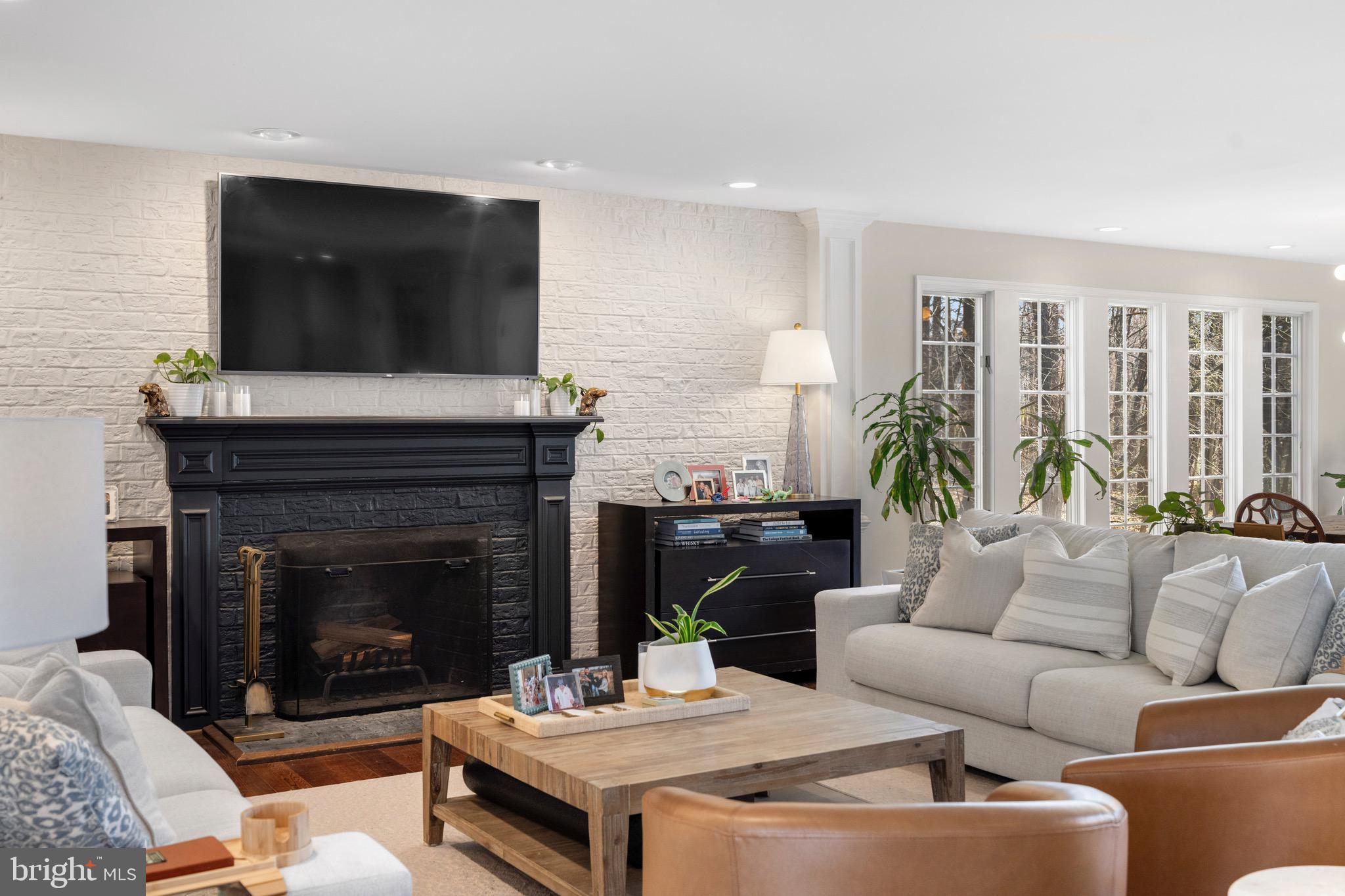 3618 Jackson Cabin Road Phoenix, MD 21131 - Photo 34 of 68 a living room with furniture a flat screen tv and a fireplace