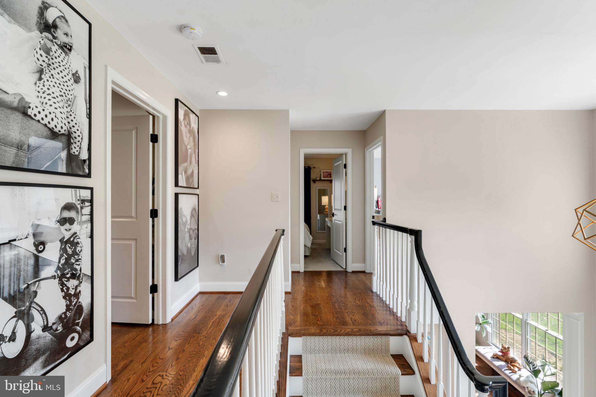 3618 Jackson Cabin Road Phoenix, MD 21131 - Photo 37 of 68 a view of a hallway with wooden floor and staircase