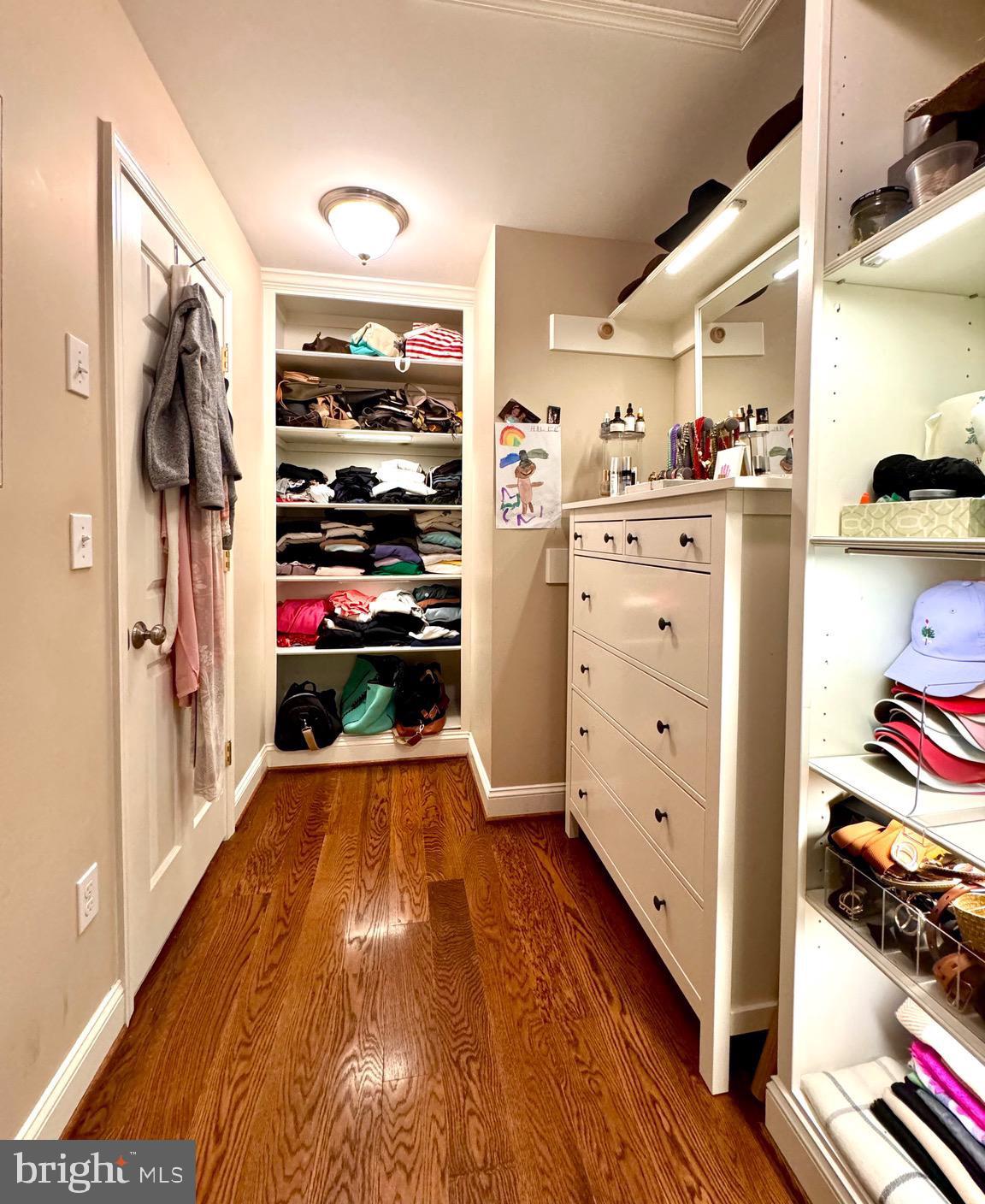 3618 Jackson Cabin Road Phoenix, MD 21131 - Photo 42 of 62 a walk in closet with wooden floor