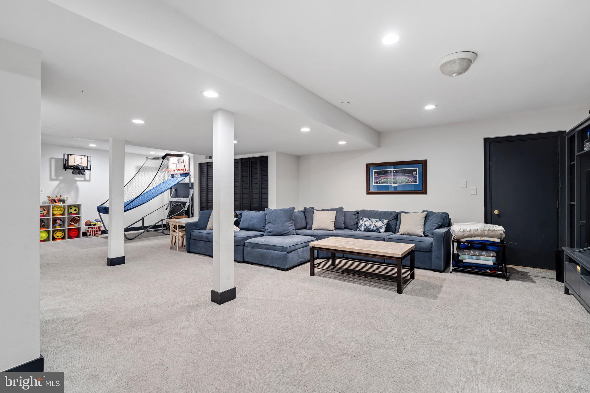 3618 Jackson Cabin Road Phoenix, MD 21131 - Photo 58 of 68 a living room with furniture gym equipment and a flat screen tv