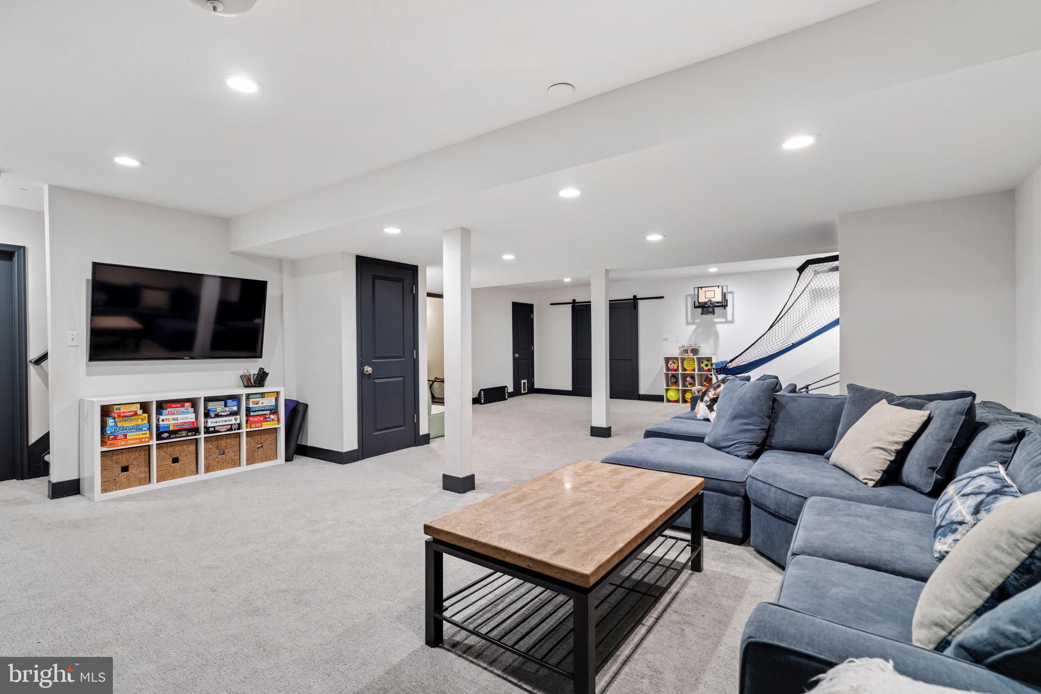 3618 Jackson Cabin Road Phoenix, MD 21131 - Photo 61 of 68 a living room with furniture and a flat screen tv