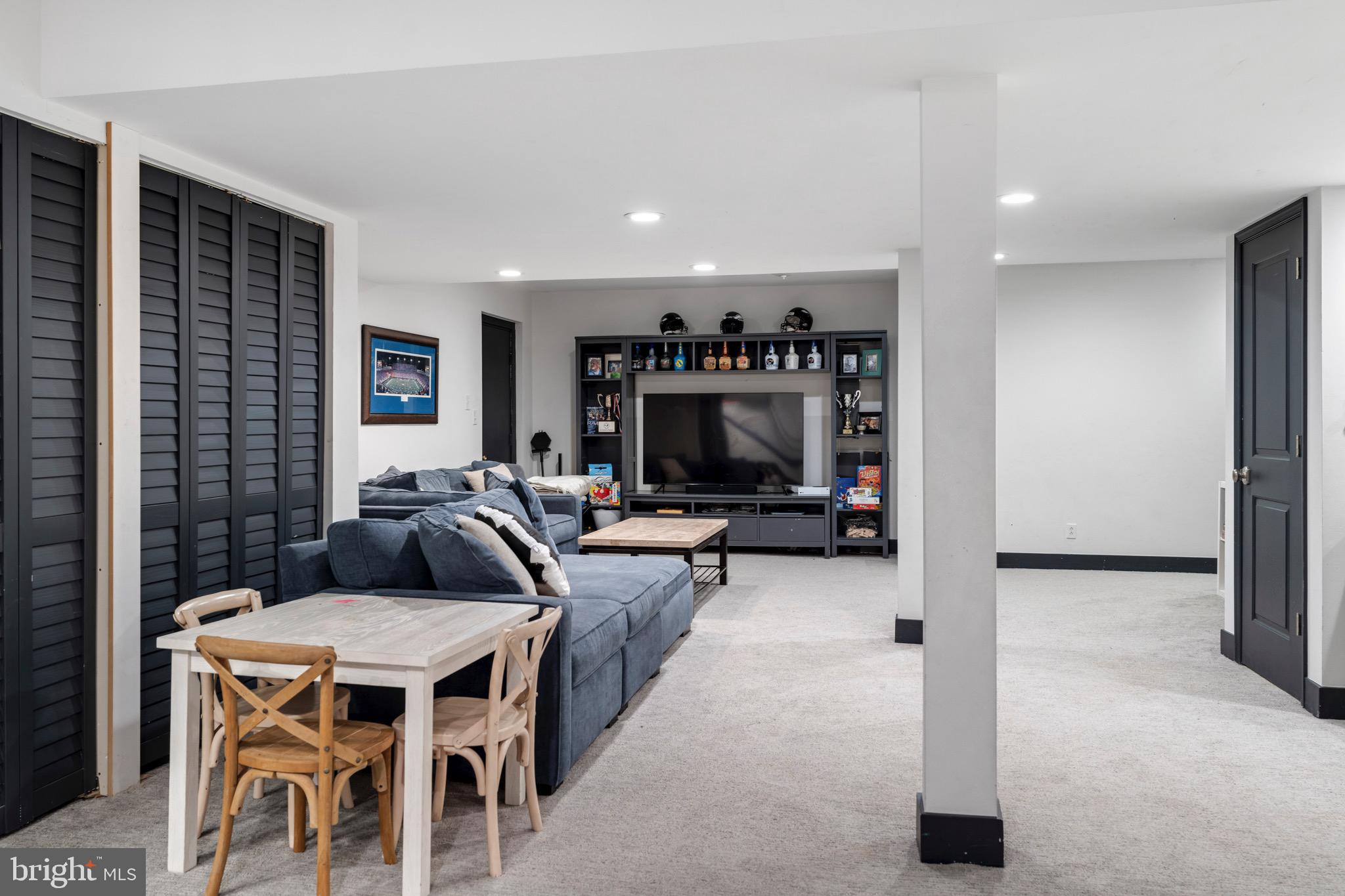 3618 Jackson Cabin Road Phoenix, MD 21131 - Photo 64 of 68 a living room with furniture a flat screen tv and a fireplace