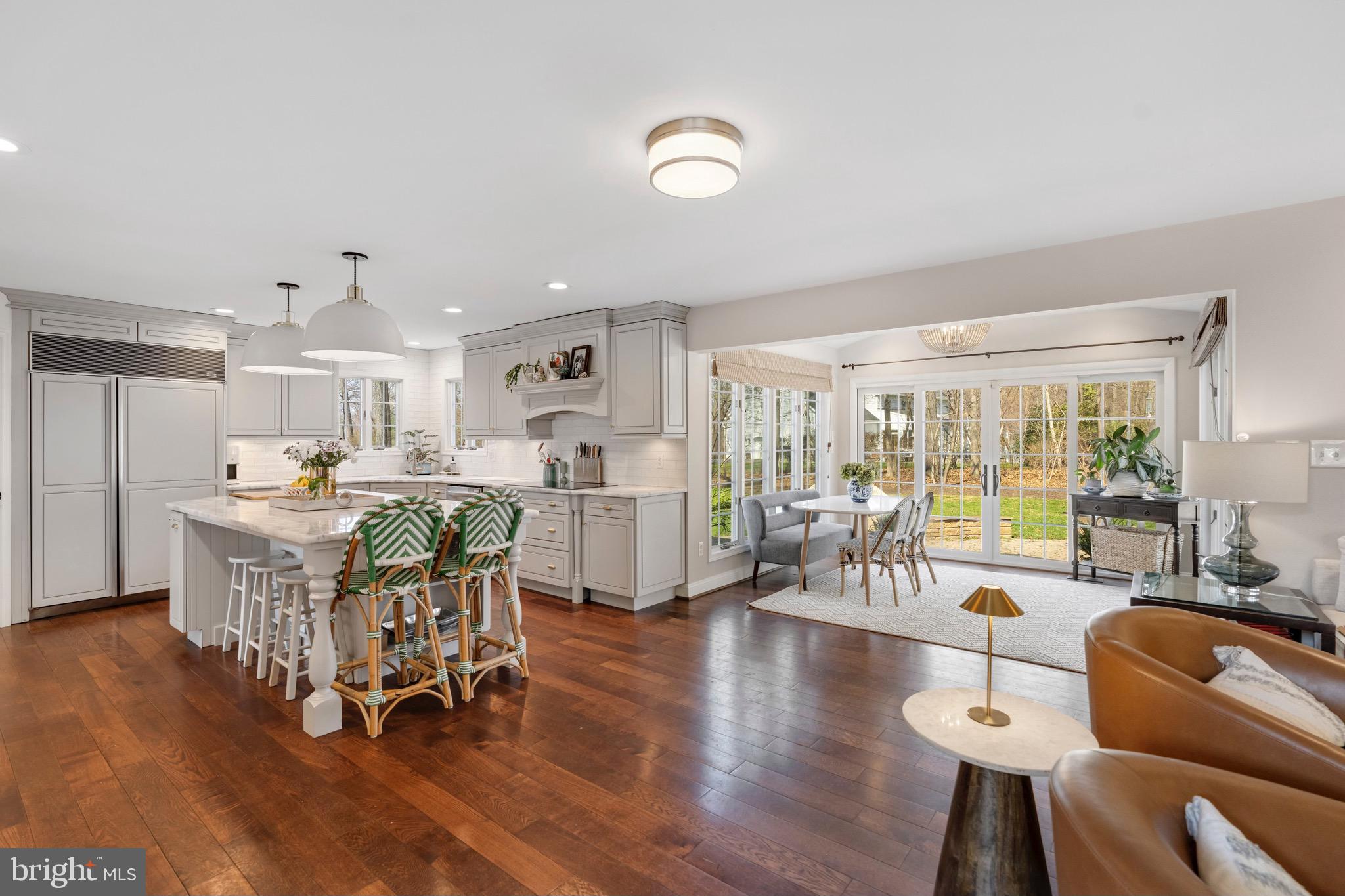 3618 Jackson Cabin Road Phoenix, MD 21131 - Photo 65 of 68 a dining room with furniture a large window and wooden floor