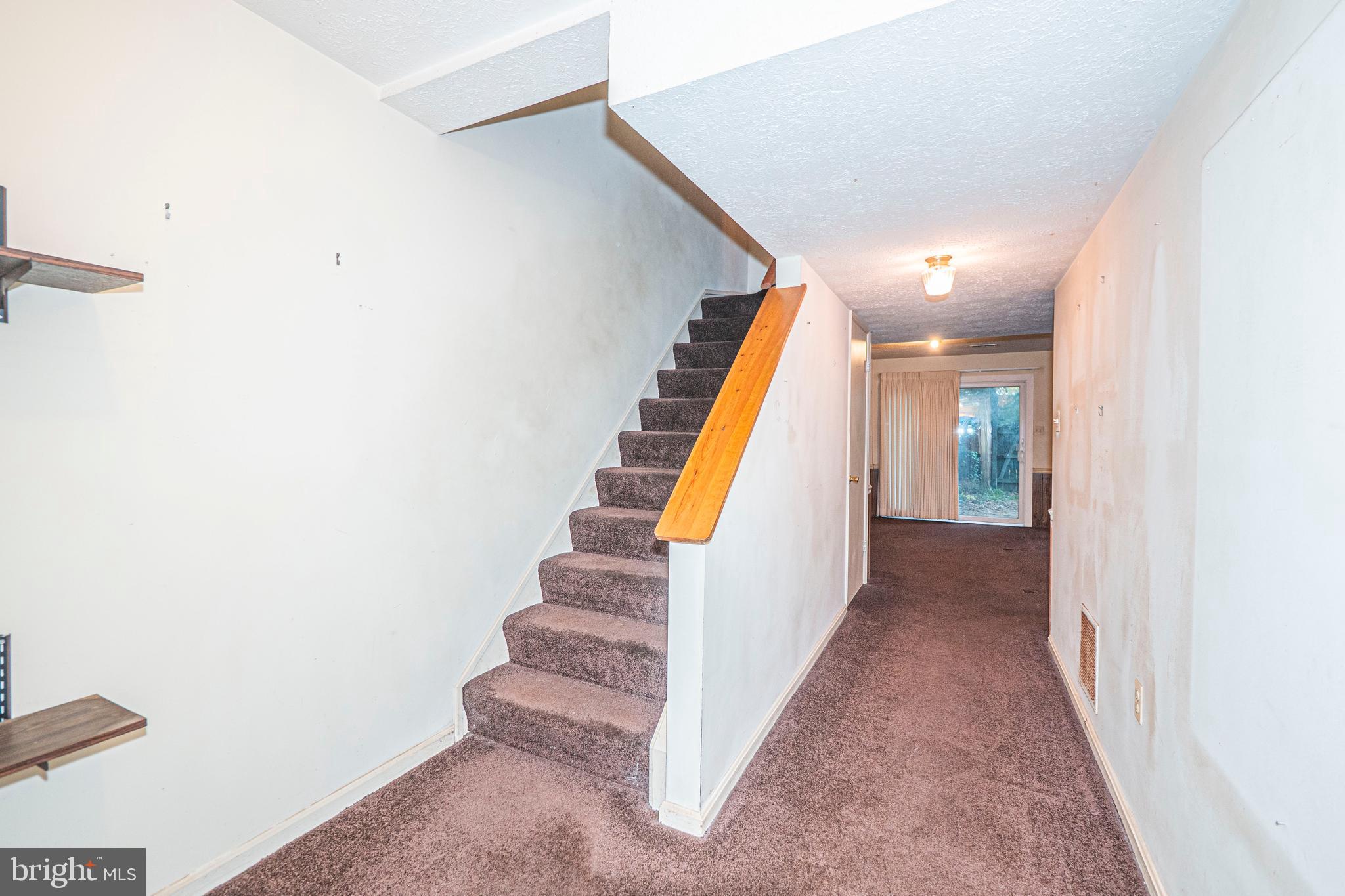 9610 Kanfer Court Gaithersburg, MD 20886 - Photo 27 of 41 a view of a hallway with staircase