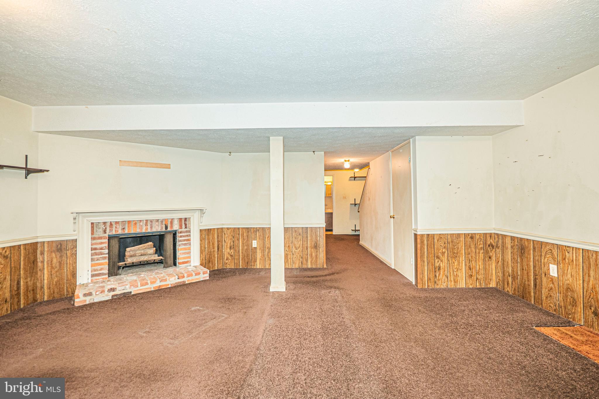 9610 Kanfer Court Gaithersburg, MD 20886 - Photo 32 of 41 a view of an empty room with a fireplace