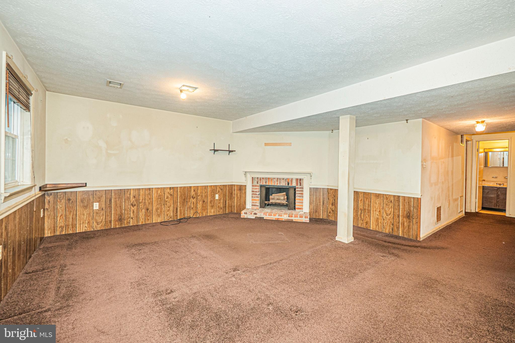 9610 Kanfer Court Gaithersburg, MD 20886 - Photo 33 of 41 a view of an empty room with a fireplace