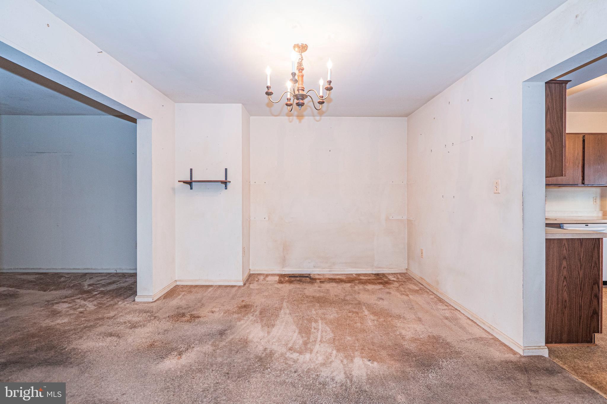 9610 Kanfer Court Gaithersburg, MD 20886 - Photo 9 of 41 a view of a livingroom with a chandelier fan