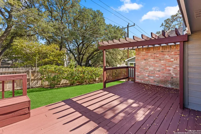 a view of a backyard with wooden floor
