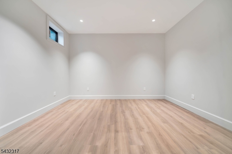 266 Brooklake Road Florham Park, NJ 07932 - Photo 43 of 50 a view of an empty room with wooden floor