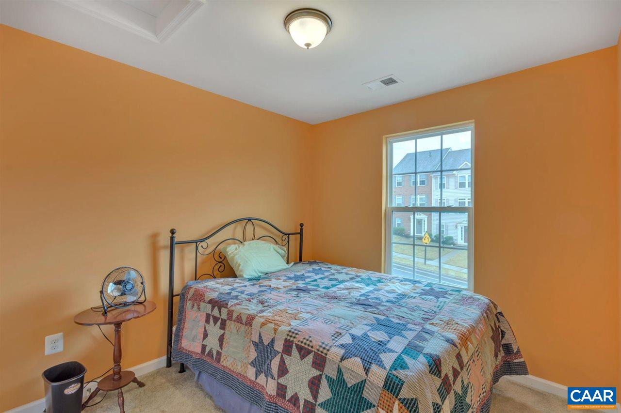 474 Rolkin Road Charlottesville, VA 22911 - Photo 16 of 42 a bedroom with a bed and a window