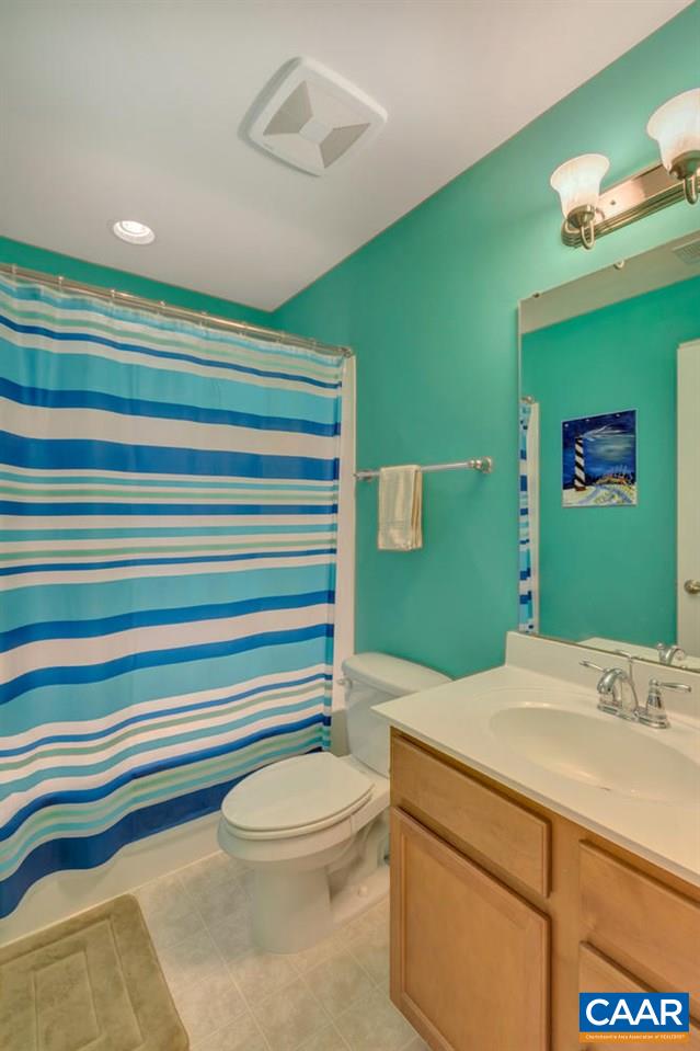 474 Rolkin Road Charlottesville, VA 22911 - Photo 18 of 42 a bathroom with a sink a toilet and mirror