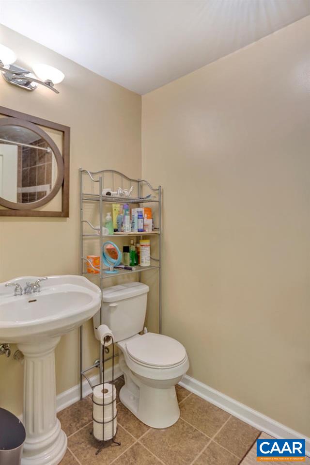 474 Rolkin Road Charlottesville, VA 22911 - Photo 22 of 42 a bathroom with a sink a toilet and a mirror