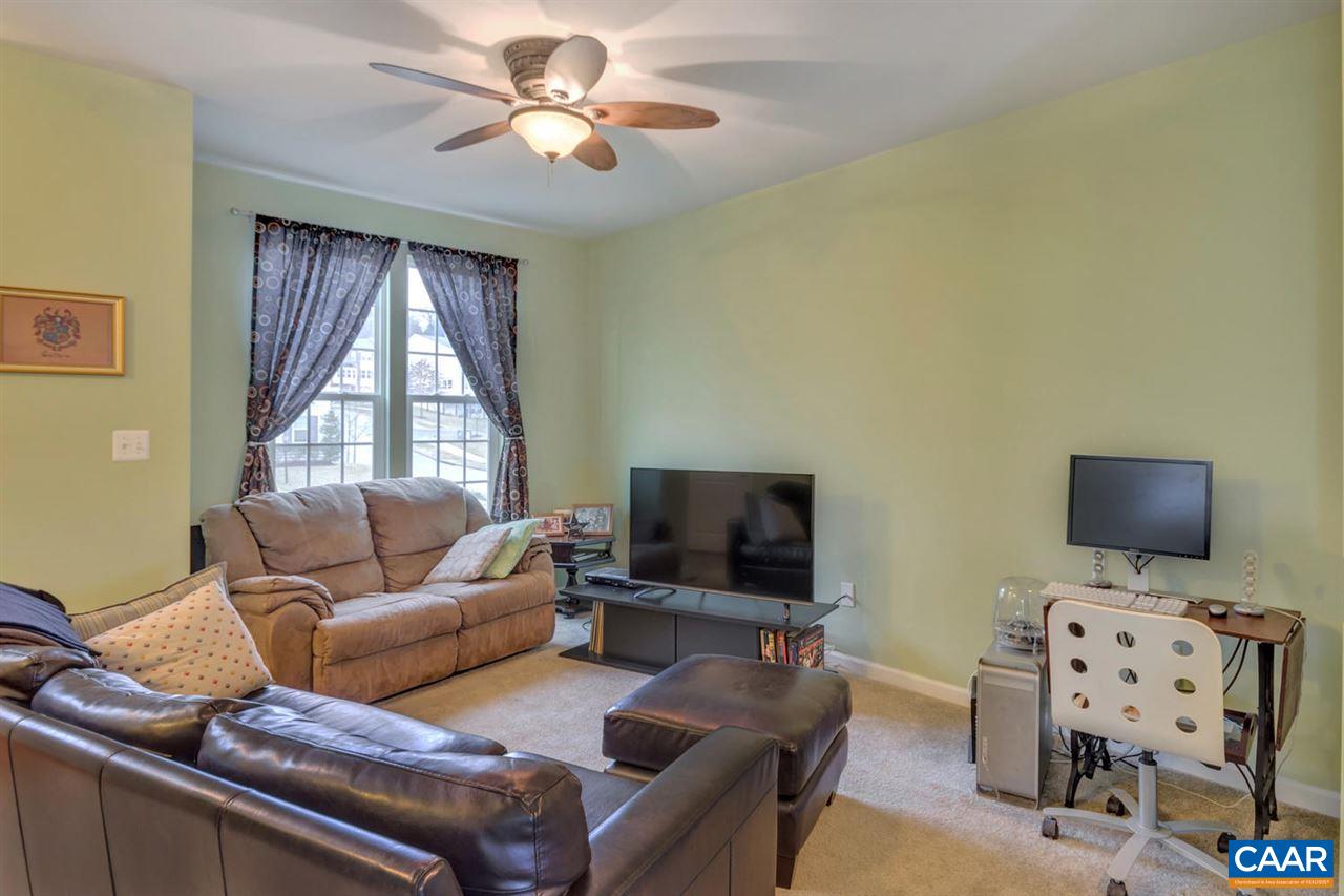 474 Rolkin Road Charlottesville, VA 22911 - Photo 5 of 42 a living room with furniture a flat screen tv and a window