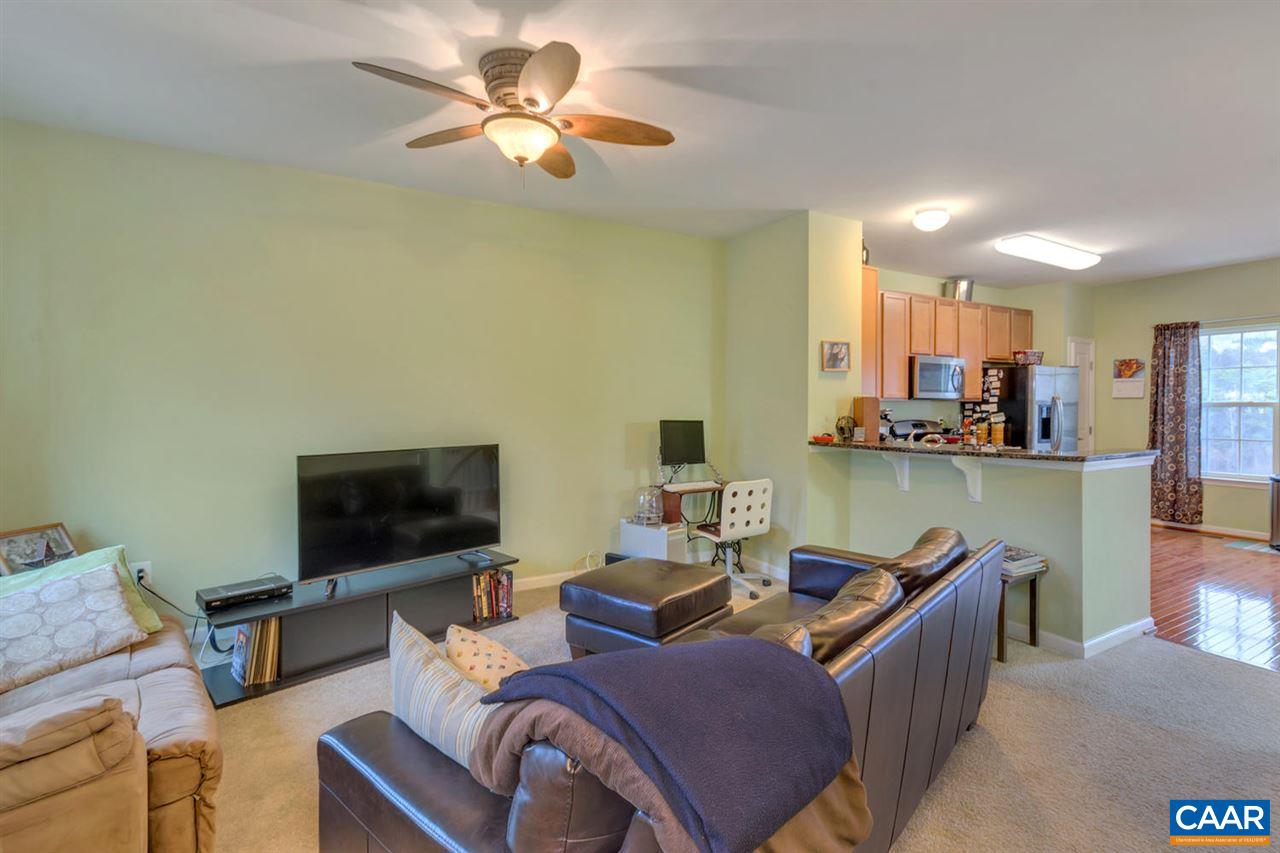 474 Rolkin Road Charlottesville, VA 22911 - Photo 6 of 42 a living room with furniture and a flat screen tv