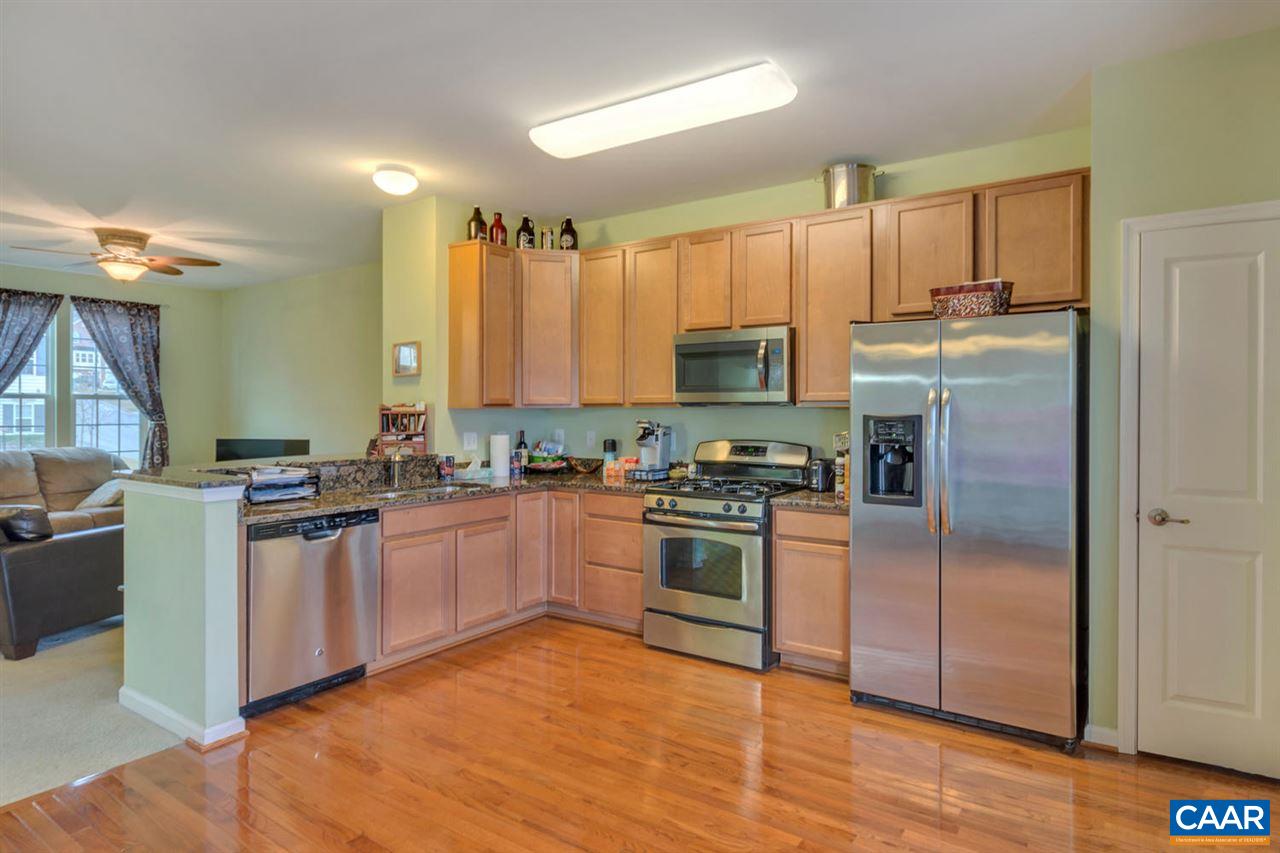 474 Rolkin Road Charlottesville, VA 22911 - Photo 8 of 42 a kitchen with stainless steel appliances granite countertop a stove top oven a sink and dishwasher