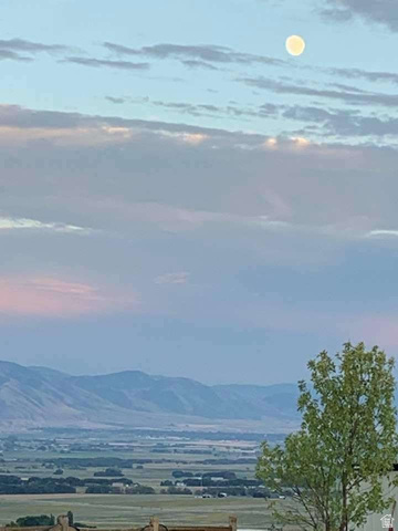 7030 West 2100 North Mendon, UT 84325 - Photo 12 of 67 Expansive mountain and valley scenery under a full moon
