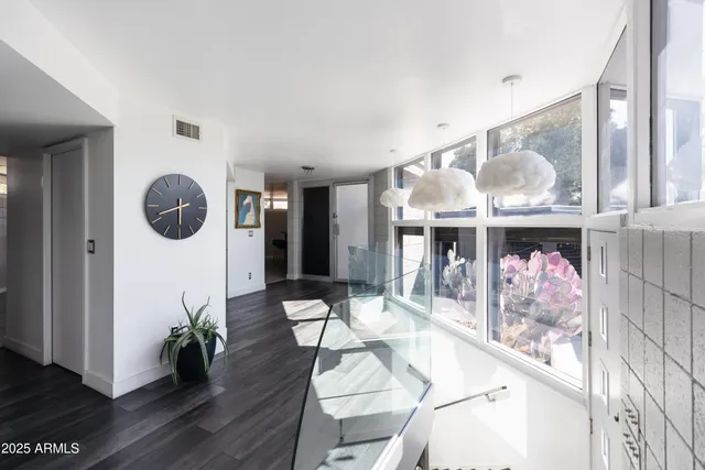 a view of a deck with chair and wooden floor