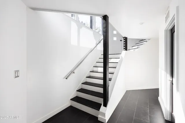 a bathroom with a tub sink and shower