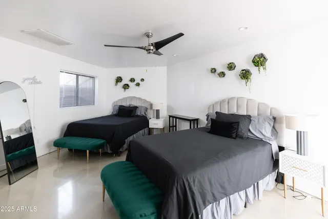 a bedroom with a bed and window