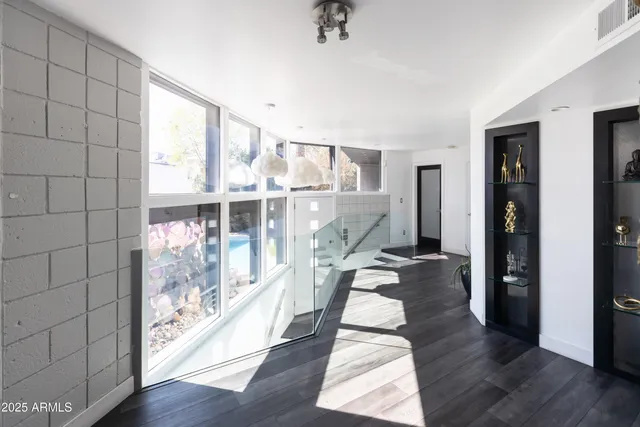 a view of water heater room with wooden floor