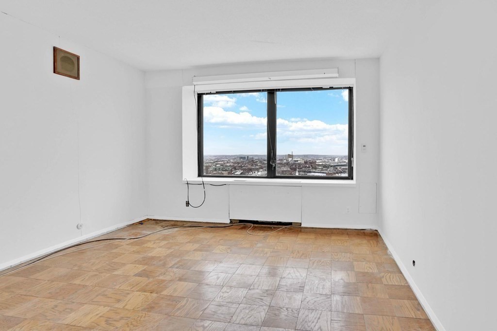 65 East India Row, Unit PHB Boston, MA 02110 - Photo 12 of 24 a view of an empty room with a window