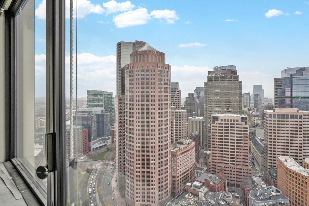 65 East India Row, Unit PHB Boston, MA 02110 - Photo 17 of 24 a view of a city with tall buildings