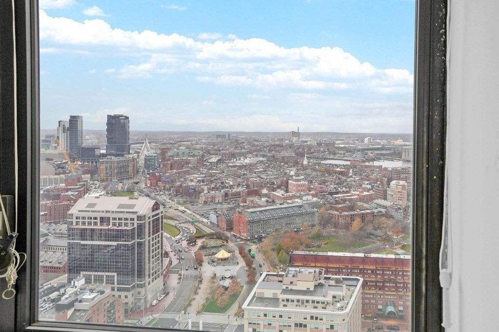 65 East India Row, Unit PHB Boston, MA 02110 - Photo 18 of 24 a view of a city with tall buildings in the background