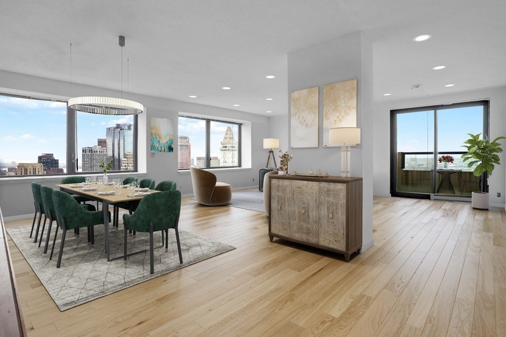 65 East India Row, Unit PHB Boston, MA 02110 - Photo 2 of 24 a living room with furniture dining table and wooden floors