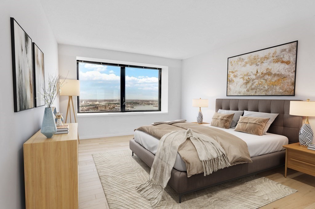 65 East India Row, Unit PHB Boston, MA 02110 - Photo 3 of 24 a bedroom with a large bed and a large window
