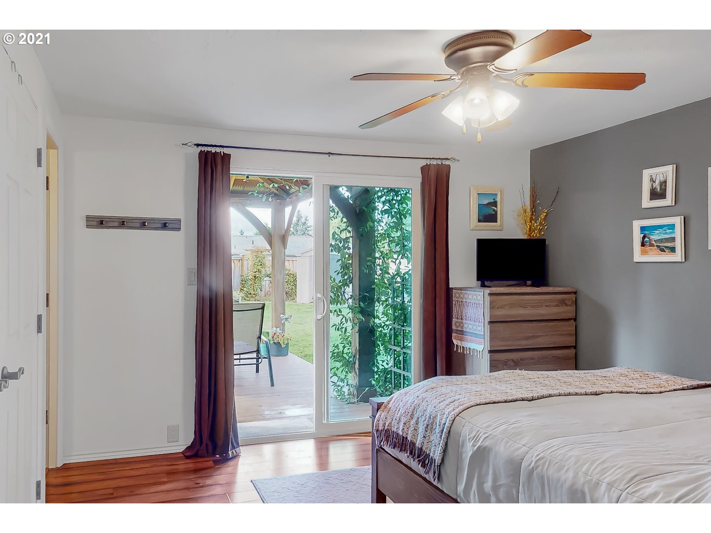 2486 York Street Eugene, OR 97404 - Photo 15 of 31 a bedroom with a bed and a flat screen tv