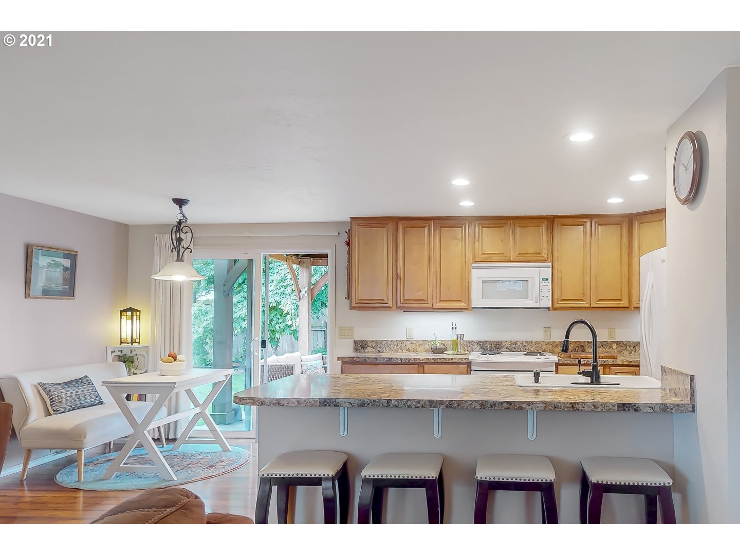 2486 York Street Eugene, OR 97404 - Photo 7 of 31 a kitchen with a sink a window and chairs