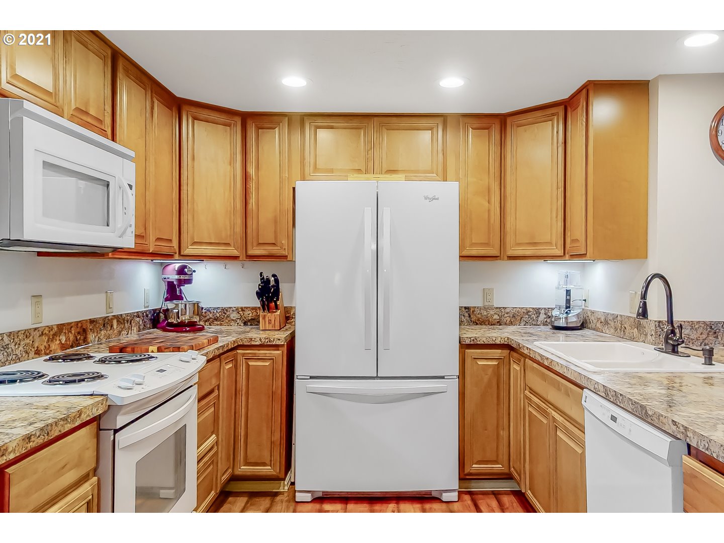 2486 York Street Eugene, OR 97404 - Photo 10 of 31 a kitchen with a white cabinets and refrigerator