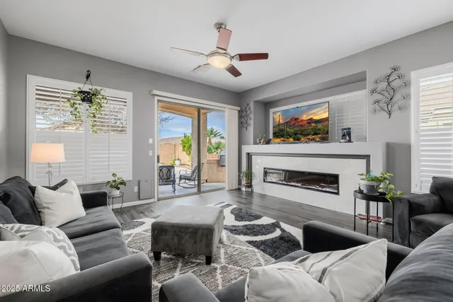 a kitchen with granite countertop a sink stove and refrigerator
