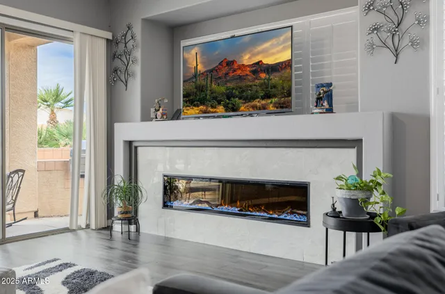 a spacious bathroom with a double vanity sink large mirror and a bathtub